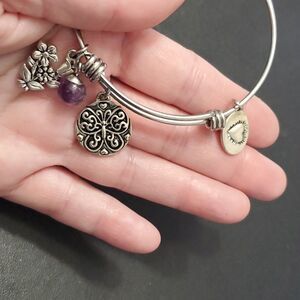 Footnotes silver tone charm bracelet